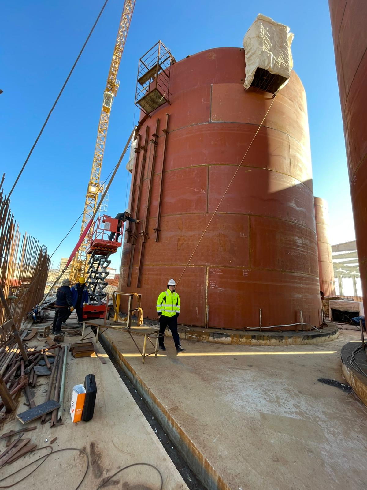 Engineer reviewing welding certification documentation